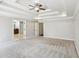 Large bedroom with tray ceilings, carpeted floors, and neutral walls at 2108 Main Nw St, Atlanta, GA 30318