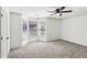 Large carpeted bedroom with bay windows and ceiling fan at 2108 Main Nw St, Atlanta, GA 30318