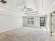 Large bedroom with tray ceilings, carpeted floors, and access to balcony at 2108 Main Nw St, Atlanta, GA 30318