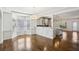 Bright dining area featuring hardwood floors and seamless flow into kitchen at 2108 Main Nw St, Atlanta, GA 30318
