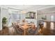 Bright dining area featuring hardwood floors and seamless flow into kitchen at 2108 Main Nw St, Atlanta, GA 30318