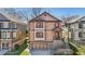 Attractive two-story home with red shutters, a cozy front porch, and a convenient attached garage at 2108 Main Nw St, Atlanta, GA 30318