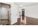 Welcoming foyer with beautiful hardwood floors leading to staircase at 2108 Main Nw St, Atlanta, GA 30318
