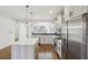 Bright, updated kitchen with stainless steel appliances, quartz countertops, and large island at 2108 Main Nw St, Atlanta, GA 30318