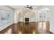 Open-concept living room with a fireplace and custom built-ins, perfect for entertaining at 2108 Main Nw St, Atlanta, GA 30318