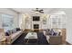 Bright living room with a fireplace, custom built-ins, and elegant decor at 2108 Main Nw St, Atlanta, GA 30318
