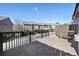 View of wooden back deck overlooking neighborhood with wood railing and privacy fence at 3898 High Dove Sw Way # 12, Smyrna, GA 30082