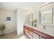 Bathroom featuring double sink vanity with ample storage space and modern lighting at 3898 High Dove Sw Way # 12, Smyrna, GA 30082