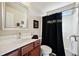 Clean bathroom featuring single vanity and shower/tub combo with dark shower curtain at 3898 High Dove Sw Way # 12, Smyrna, GA 30082