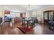 Dining room with hardwood floors, chandelier, and view into the open-concept kitchen at 3898 High Dove Sw Way # 12, Smyrna, GA 30082