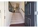 Welcoming entryway with hardwood floors, staircase, and view into the home at 3898 High Dove Sw Way # 12, Smyrna, GA 30082