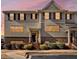 Charming townhome with gray siding, brick accents, black shutters, and manicured landscaping at 3898 High Dove Sw Way # 12, Smyrna, GA 30082