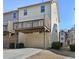 Charming townhome exterior featuring a private deck above a convenient one-car garage at 3898 High Dove Sw Way # 12, Smyrna, GA 30082