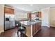 Spacious kitchen with stainless steel appliances, granite countertops, and hardwood floors at 3898 High Dove Sw Way # 12, Smyrna, GA 30082