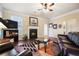 Cozy living room with a fireplace, hardwood floors, and a comfortable seating area at 3898 High Dove Sw Way # 12, Smyrna, GA 30082
