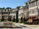 Beautiful street view of The Verandas at Barnes Mill with townhouses and manicured landscaping at 3898 High Dove Sw Way # 12, Smyrna, GA 30082