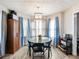Inviting dining room with large windows and a modern light fixture at 443 Rhett Dr, Loganville, GA 30052