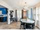 Bright dining room with hardwood floors and views into the kitchen at 443 Rhett Dr, Loganville, GA 30052