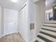 Entryway and staircase with coat closet and new laminate flooring at 443 Rhett Dr, Loganville, GA 30052