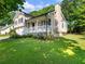 Charming two-story home with a landscaped front yard, covered porch at 443 Rhett Dr, Loganville, GA 30052