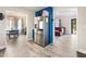 Open concept kitchen leading to the dining and living spaces at 443 Rhett Dr, Loganville, GA 30052
