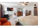 Spacious main bedroom with a ceiling fan, a TV and ensuite bath at 443 Rhett Dr, Loganville, GA 30052