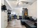 Office space with laminate floors, mounted tv and plenty of seating at 443 Rhett Dr, Loganville, GA 30052