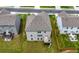 Aerial view of home with a deck and backyard, in a neighborhood setting at 865 Athena Bnd, Fairburn, GA 30213