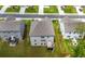 Aerial view of home featuring a deck, grassy backyard, and neighborhood surroundings at 865 Athena Bnd, Fairburn, GA 30213