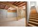 Unfinished basement with framed walls and exposed ceiling, ready for customization and added living space at 865 Athena Bnd, Fairburn, GA 30213