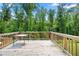 Spacious outdoor deck perfect for entertaining, surrounded by lush trees and greenery at 865 Athena Bnd, Fairburn, GA 30213