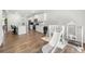 Open-concept living space with playroom and kitchen featuring stainless steel appliances at 865 Athena Bnd, Fairburn, GA 30213