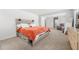 Spacious main bedroom with neutral walls and carpet, featuring large bed with storage at 865 Athena Bnd, Fairburn, GA 30213