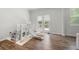 Bright playroom features french doors leading to a wooden deck and backyard at 865 Athena Bnd, Fairburn, GA 30213