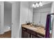 Bathroom vanity features granite countertop, undermount sink, and brushed nickel faucet and towel rack at 1481 Howard Way, Lawrenceville, GA 30043