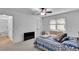 Cozy bedroom with neutral carpet, a queen sized bed, and a TV at 1481 Howard Way, Lawrenceville, GA 30043