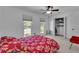 Bright bedroom with neutral carpet, closet, and two windows at 1481 Howard Way, Lawrenceville, GA 30043