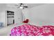 Bright bedroom with neutral carpet, closet, and red accent chair at 1481 Howard Way, Lawrenceville, GA 30043