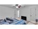 Bright bedroom with neutral carpet, a queen sized bed, and two doorways at 1481 Howard Way, Lawrenceville, GA 30043