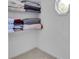 Walk-in closet features white wire shelving, neutral carpet, and an octagonal window at 1481 Howard Way, Lawrenceville, GA 30043