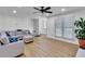 Comfortable living room featuring natural light, wood flooring, and stairs at 1481 Howard Way, Lawrenceville, GA 30043