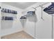 Spacious walk-in closet with ample shelving for clothes and accessories at 1481 Howard Way, Lawrenceville, GA 30043