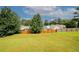 Well-maintained backyard with a lush green lawn and a wooden fence for privacy at 2397 Planters Cove Dr, Lawrenceville, GA 30044