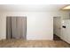 Open dining area featuring a gray curtain, easy access to the kitchen, and neutral decor at 2397 Planters Cove Dr, Lawrenceville, GA 30044