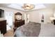 Comfortable bedroom featuring a ceiling fan, dresser, and access to the bathroom, and closet at 2397 Planters Cove Dr, Lawrenceville, GA 30044