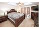 Spacious main bedroom featuring a ceiling fan, TV, and dresser for ample storage and comfort at 2397 Planters Cove Dr, Lawrenceville, GA 30044