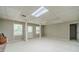 Open basement area with windows for natural light and white support beams at 4989 Woodfall Sw Dr, Lilburn, GA 30047