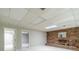 Basement featuring a brick fireplace and neutral carpeting at 4989 Woodfall Sw Dr, Lilburn, GA 30047