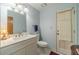 Bathroom features a white vanity, sink, and an exterior door at 4989 Woodfall Sw Dr, Lilburn, GA 30047