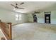 Large bonus room with neutral carpet and ceiling fans at 4989 Woodfall Sw Dr, Lilburn, GA 30047